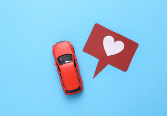 Feedback from a taxi service or car sharing company. Like icon with toy car on pink background. Rating, followers feedback. Top view
