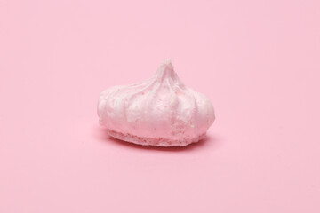 Sweet meringue on a pink background