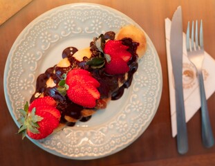 chocolate covered croissant with strawberries, latin dessert, pastry and decoration
