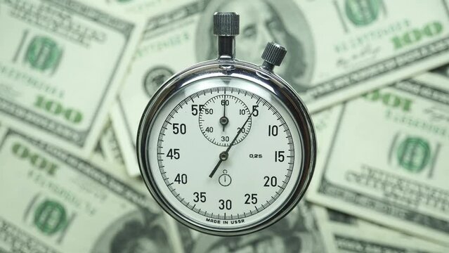 Countdown 30 Seconds Against the Background of Rotating One Hundred Dollar Bills