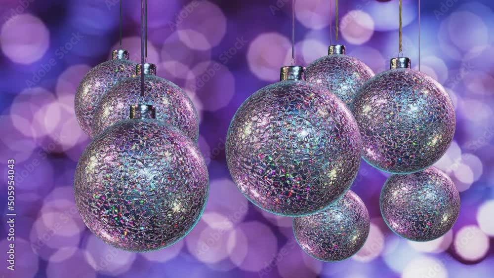 Poster realistic looping 3d animation of the hanging spinning iridescent silver metallic christmas balls co