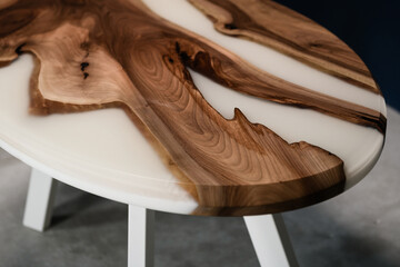 handmade design table made of natural wood and white epoxy resin