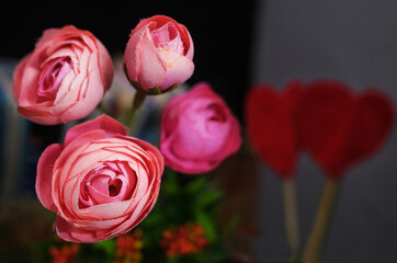 Fototapeta na wymiar vase with beautiful artificial flowers peonies pink selective background