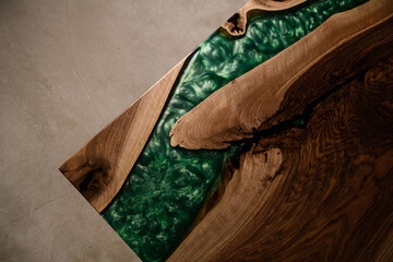 table top made of natural solid wood and green epoxy top view