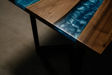 textured table made of solid wood and blue epoxy resin - obrazy, fototapety, plakaty
