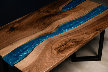 large table for the interior of natural wood blue epoxy