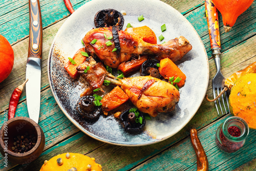 Wall mural Grilled chicken legs with pumpkin