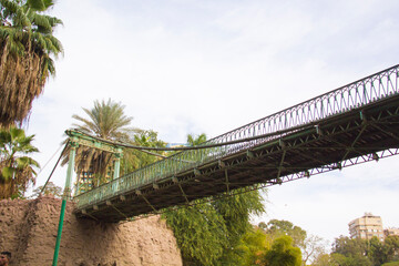 CAIRO, EGYPT - DECEMBER 29, 2021: Bridge by Gustave Eiffel in Giza zoo in Cairo, Egypt