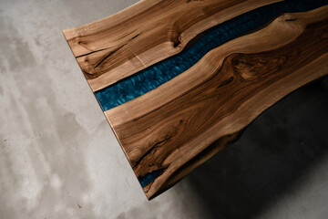 large kitchen table made of natural wood and epoxy resin top view