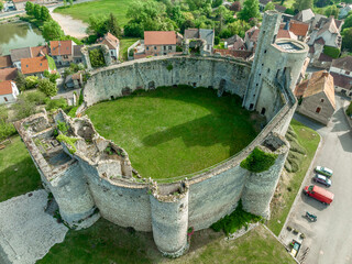Aerial view of Billy castle in Central France with donjon, four semi circle towers and fortified...