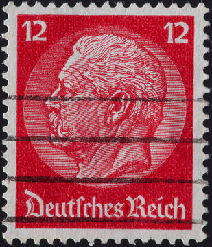 GERMANY - CIRCA 1933: A Postage Stamp From The German Empire, Showing The Portrait Of The Reich President And Field Marshal Paul Von Hindenburg On A Medallion. Circa 1933