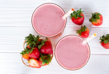 Strawberry  smoothies juice beverage healthy the taste yummy In glass drink episode morning on wooden background from the top view.