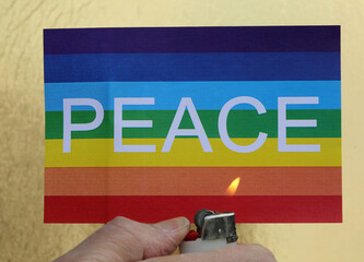banner with word peace and hand with lighter symbolizing war that destroys peace forever