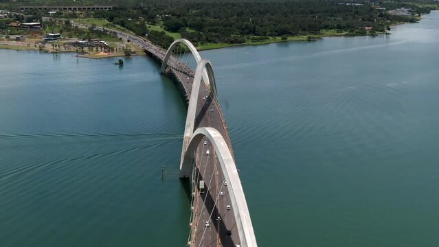 Aerial view of traffic on JK Bridge (Portuguese: Ponte JK ), a steel and concrete arch bridge across Lake Paranoa in Brasilia, Federal District, capital of Brazil.