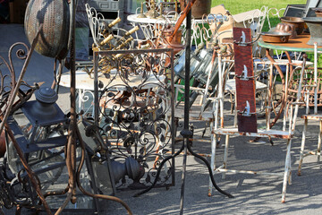 pieces of vintage furniture at the antiques stall in the outdoor flea market