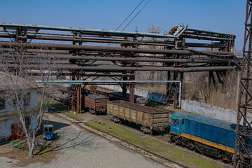 Gas pipelines at a metallurgical plant against the blue sky. Concept of economic crisis. Ecology...
