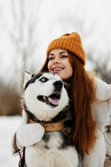 woman with dog outdoor games snow fun travel winter holidays
