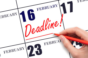 Hand drawing red line and writing the text Deadline on calendar date February 16. Deadline word written on calendar