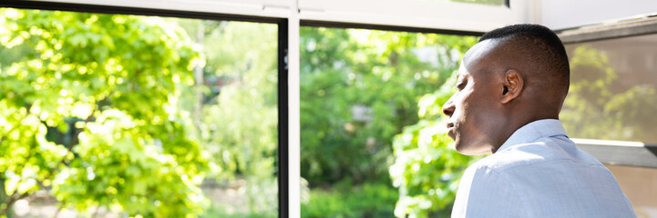 Man Breathing Fresh Air At Home