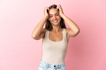 Young woman over isolated pink background laughing