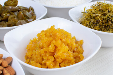 Variety of topping, ingredients to accompany sushi, displayed in white container