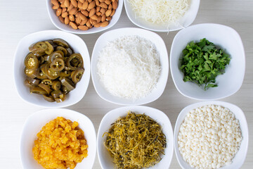 Variety of topping, ingredients to accompany sushi, displayed in white container