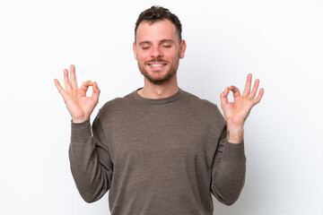 Fototapeta premium Young Brazilian man isolated on white background in zen pose