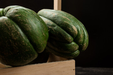 Fresh green traditional latin fruit on black wooden table