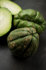 Fresh green traditional latin fruit on black wooden table