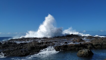 Sea wave crashing on the rock