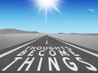 Thoughts Become Things quote on highway for motivational concept.