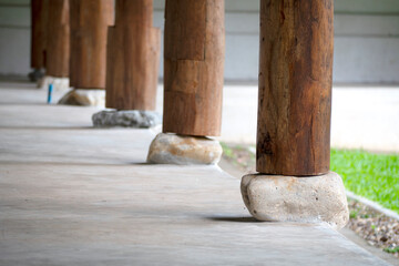 Wooden Pole on stone in Architecture Construction.