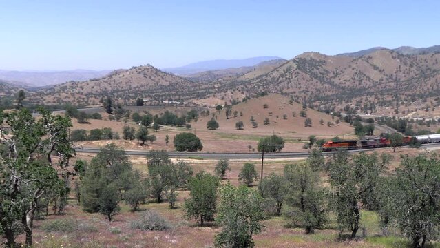 The Tehachapi Loop where Trains Cross over themselves to Climb a Steep Grade with 2 Trains Crossing together Time Lapse