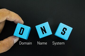 a blue cube with the letters DNS and the word domain name system