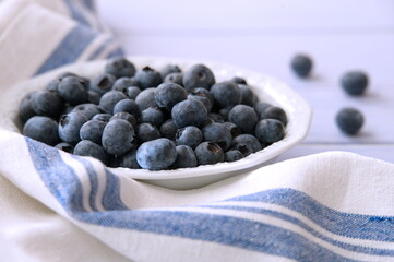 Closeup shot of bowl with blueberries on table