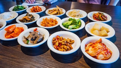 Gordijnen Close up shot of many Korean style appetizer © Kit Leong