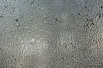 Wet glass texture, sweaty window. Abstract background, wallpaper.