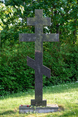 Stone Orthodox cross in the cemetery.