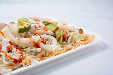 A closeup view of a chicharron avocado salad.