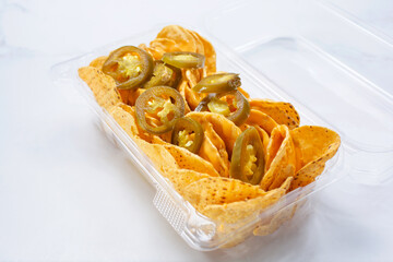 A view of a container of nachos.