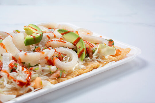 A closeup view of a chicharron avocado salad.