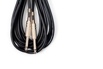 Long black jack cord for electric guitar, filmed on a white background.