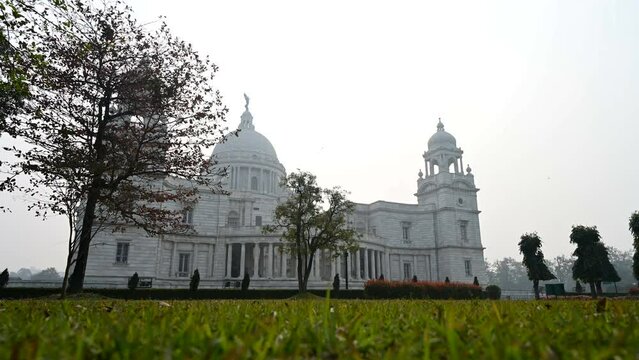 4K stock timelapse video of Victoria Memorial, a large marble building in Central Kolkata, It is one of the famous monuments of Kolkata, West Bengal, India.