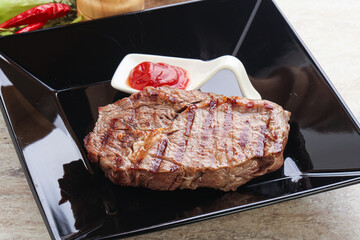 Grilled rib-eye steak beef meat
