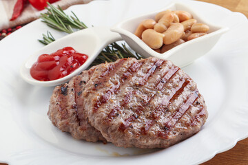 Grilled beef burger cutlet with sauce