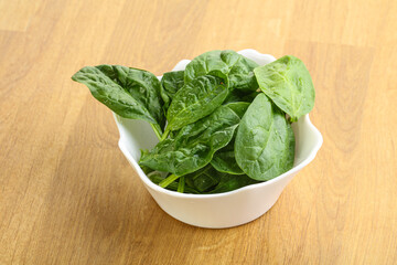 Fresh green spinach leaves in the bowl