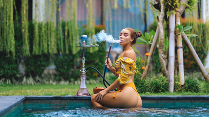 Girl at the pool with a hookah..