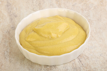 Organic mustard sauce in the bowl