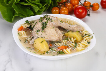 Chicken soup with leg and macaroni