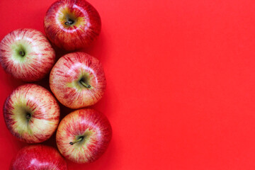 red apples on a red background